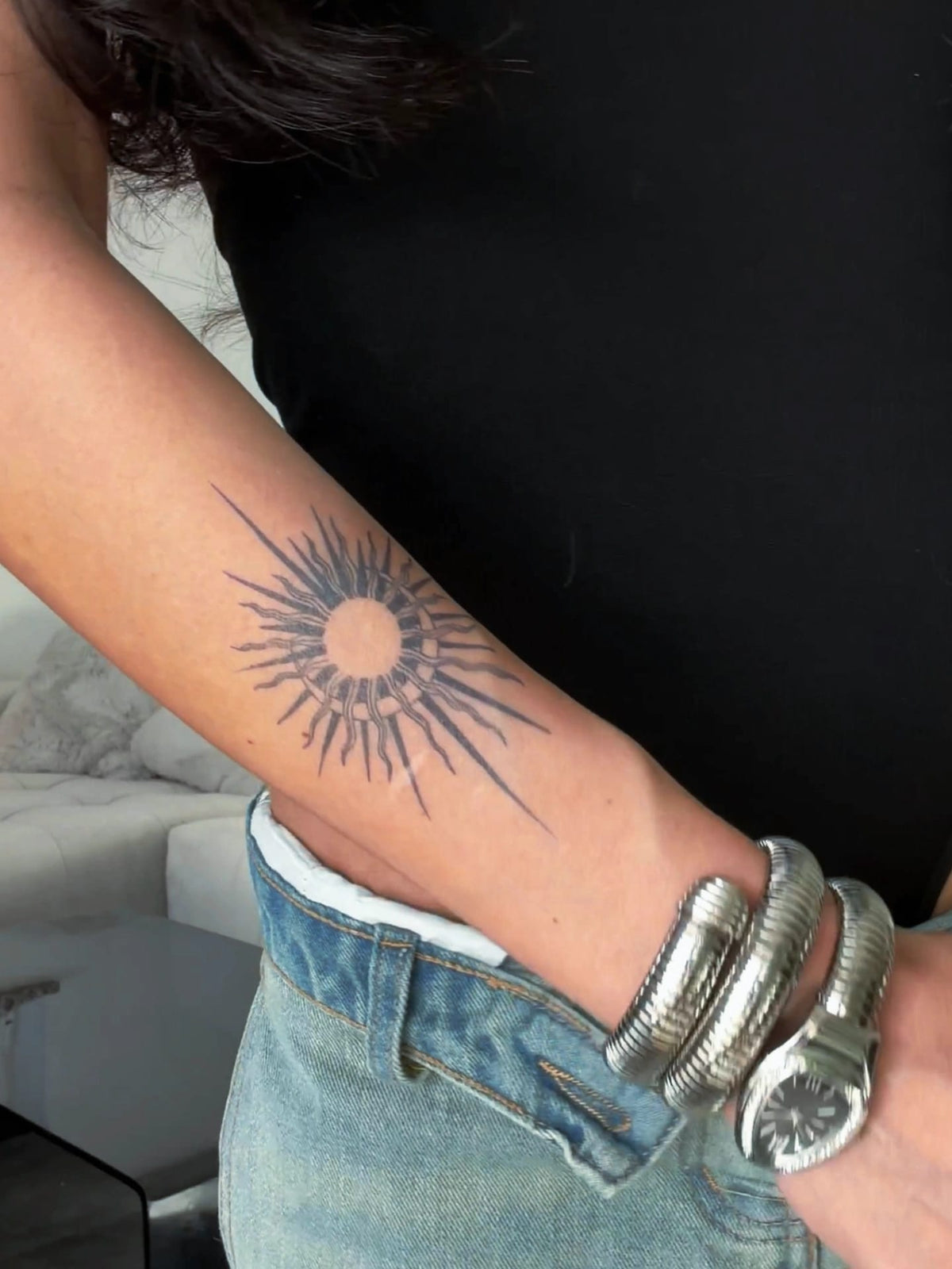 Tattup 2-week tattoo of a sun on a woman’s forearm
